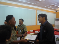 Balay representative, Mr. Carlos receiving a certificate of appreciation from Maj. Gen. Bambao for giving out a lecture about torture in the Philippine context and a discussion about the Anti-Torture Law of 2009